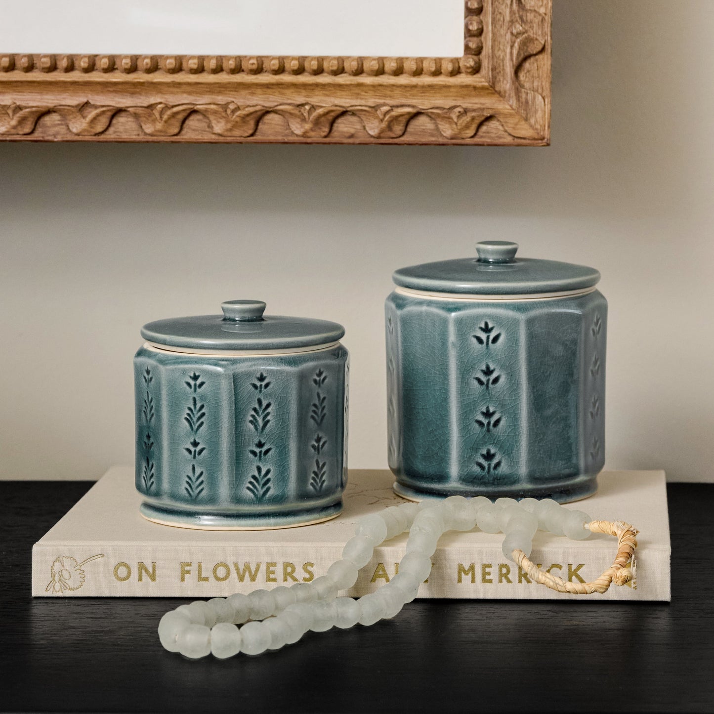 Harper Ceramic Floral Canister styled with decorative accessories in a room