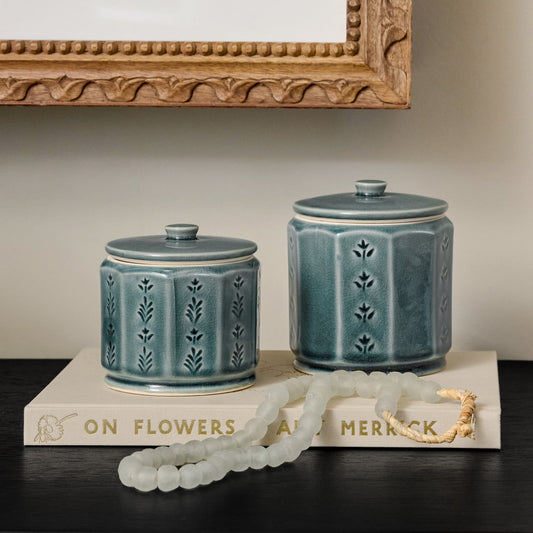 Harper Ceramic Floral Canister styled with decorative accessories in a room