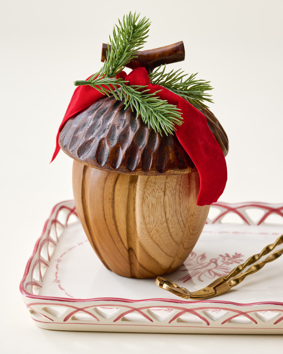 Magnolia Acorn Candle on tray with snuffer