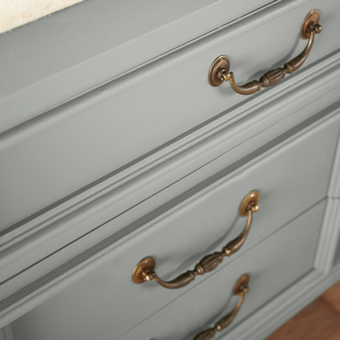 An overcast gray with hints of pale blue and green door and cabinet paint  named weathered windmill shown painted on cabinet