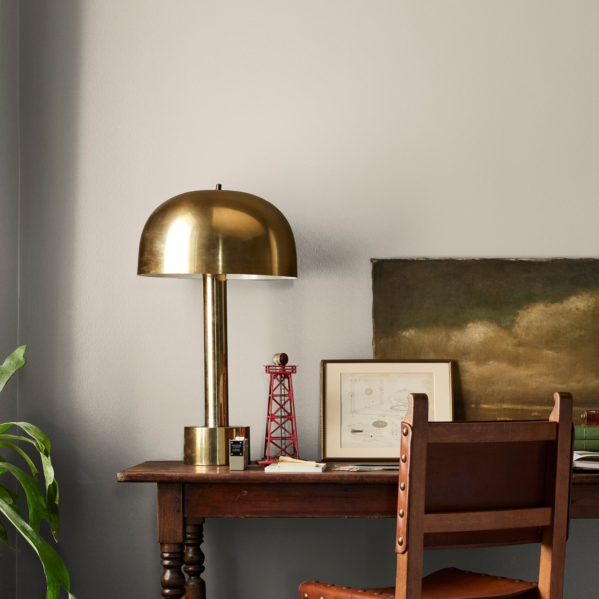 medium grey with tan interior paint named gatherings shown painted on bedroom wall
