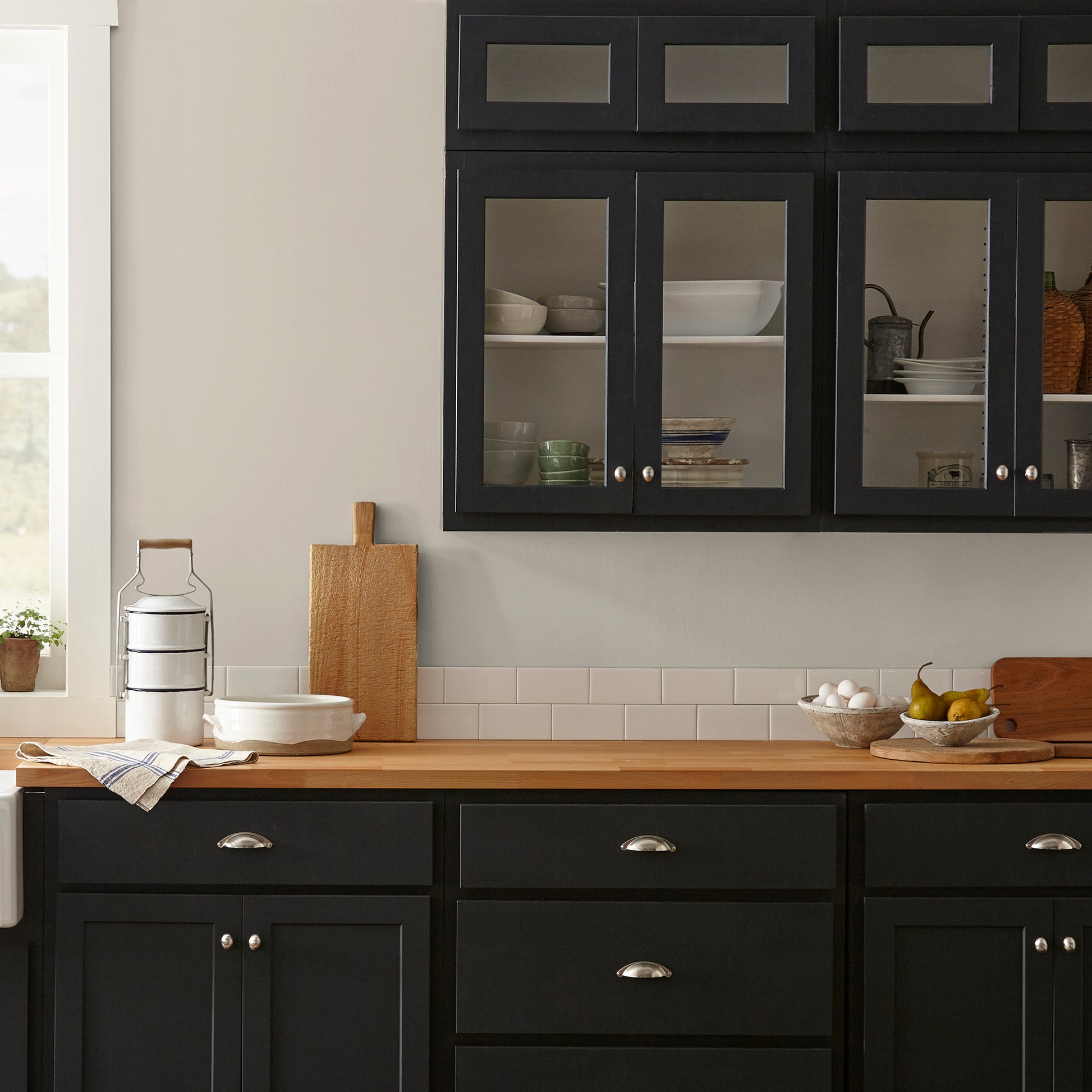 medium grey with tan interior paint named gatherings shown painted on kitchen wall