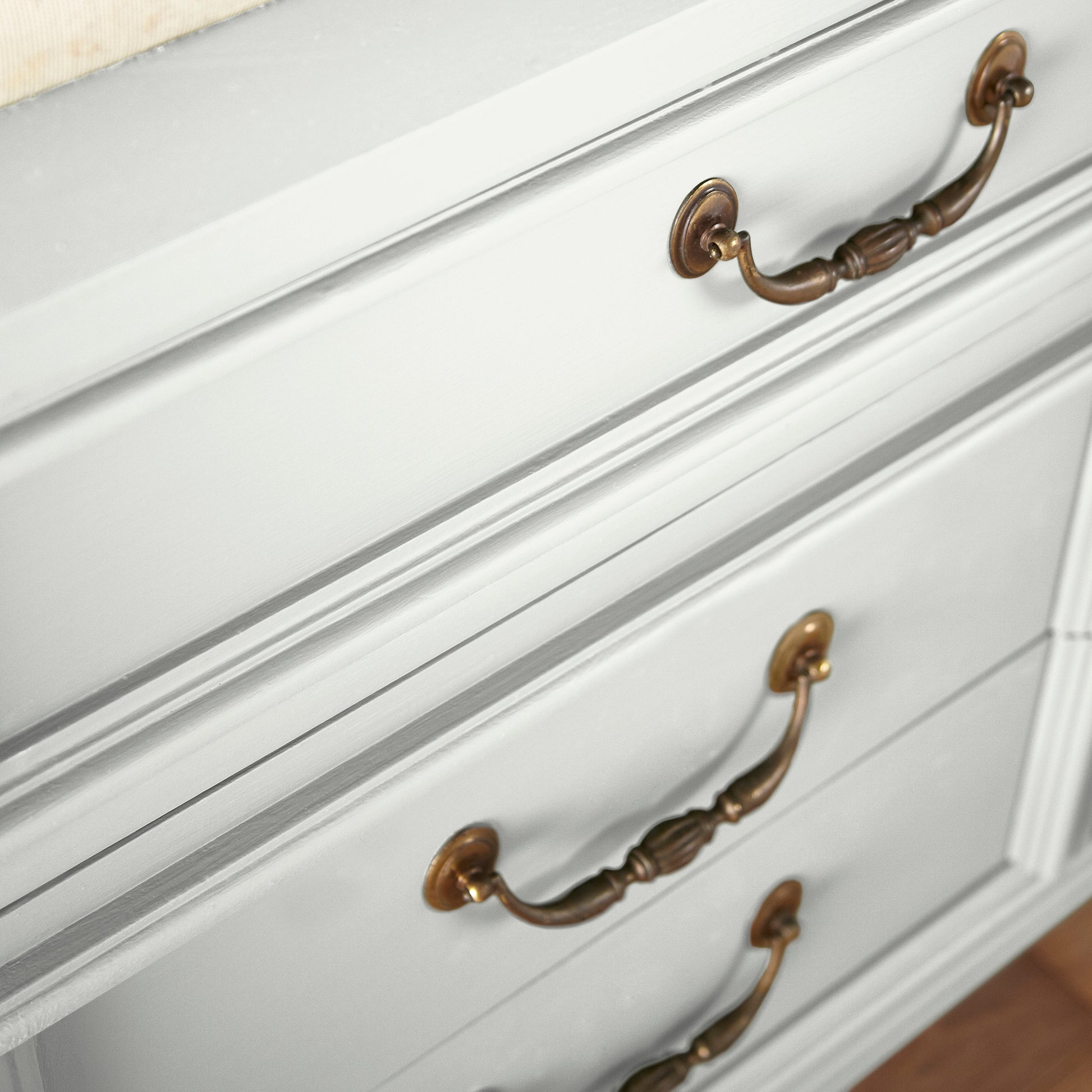 A pure white trim and cabinetry paint named true white shown painted on cabinet