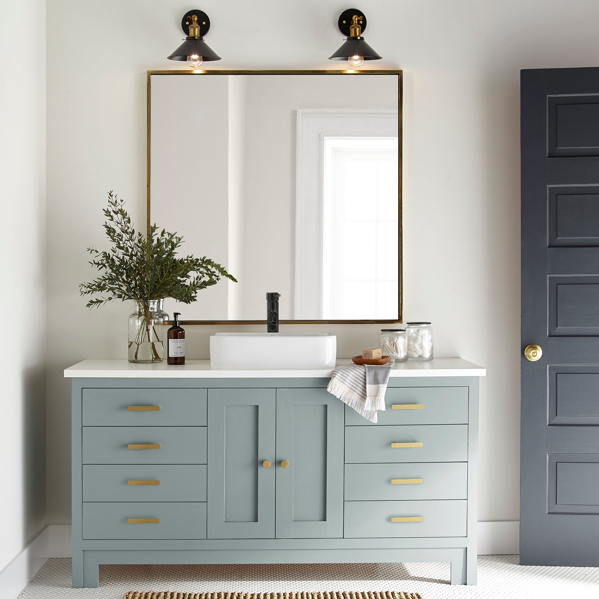 muted grey-blue paint named rainy days shown painted on bathroom cabinet
