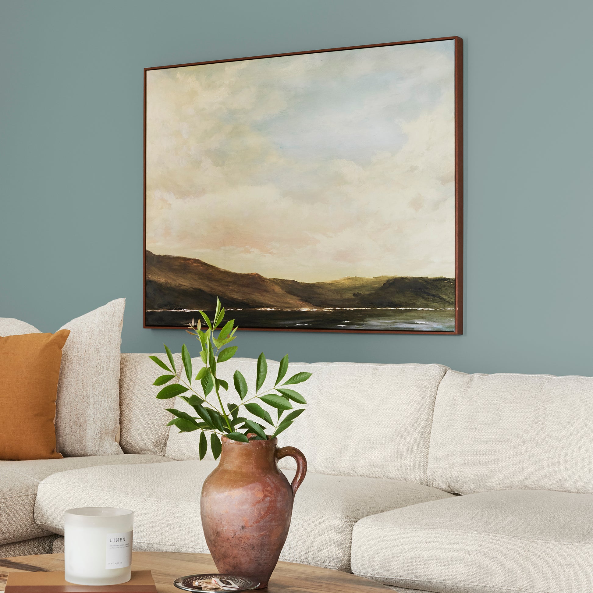 medium grey-aqua blue interior paint named sir drake shown painted on living room wall