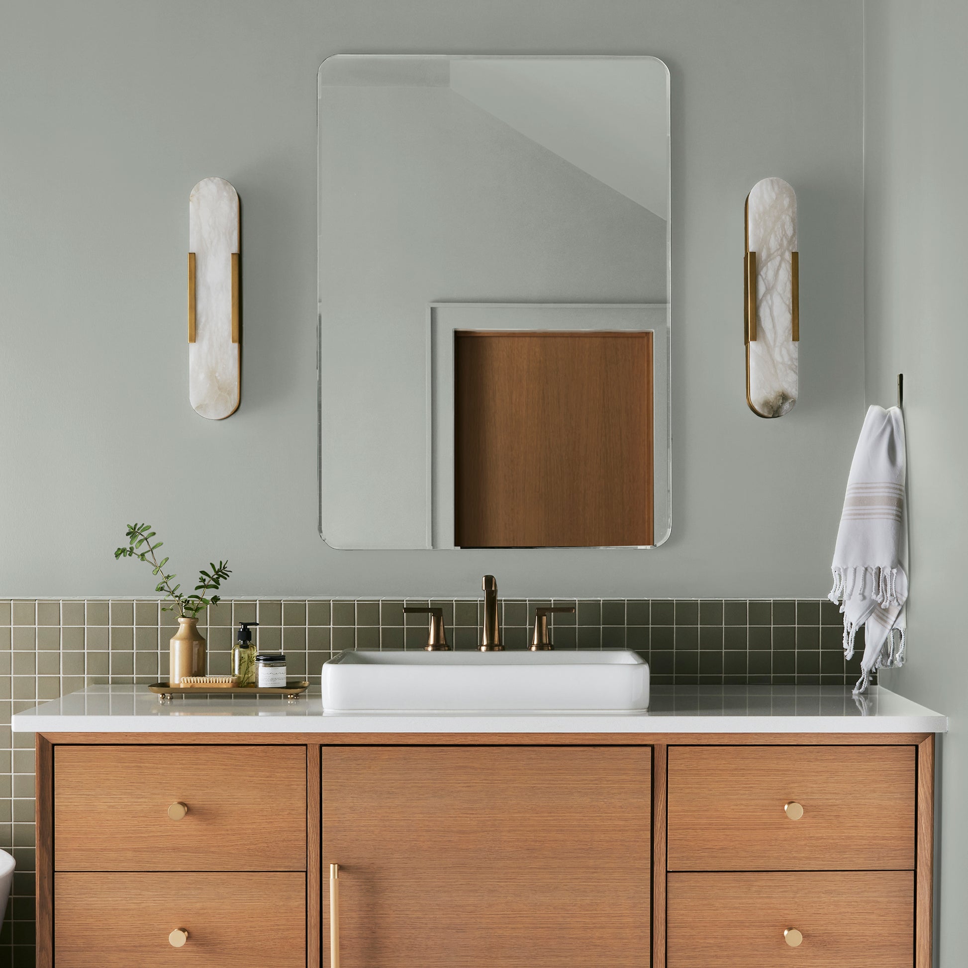 light blue grey with light green undertone interior paint named emmies room shown painted on bathroom wall