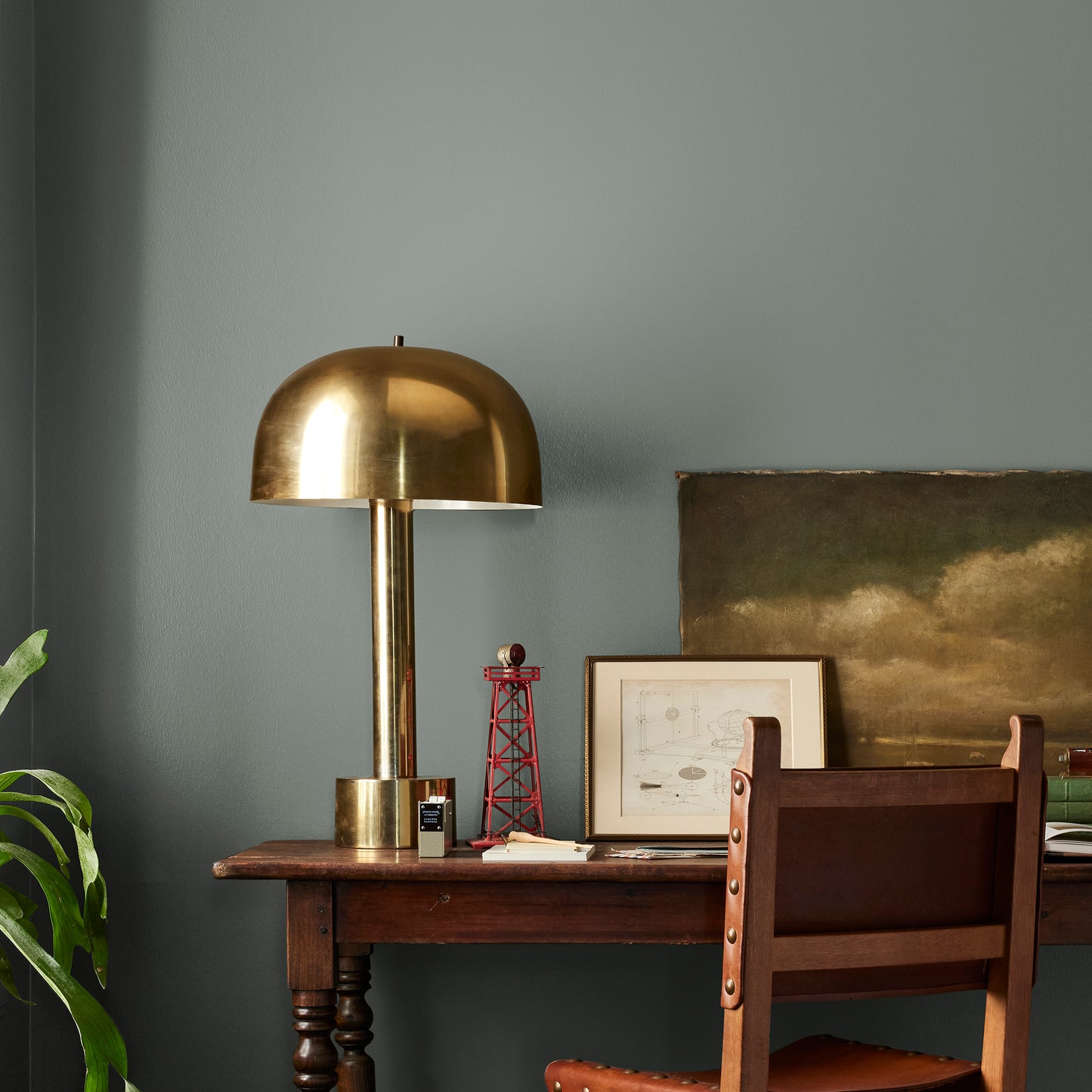 dark green-grey interior paint named luxe shown painted on bedroom wall