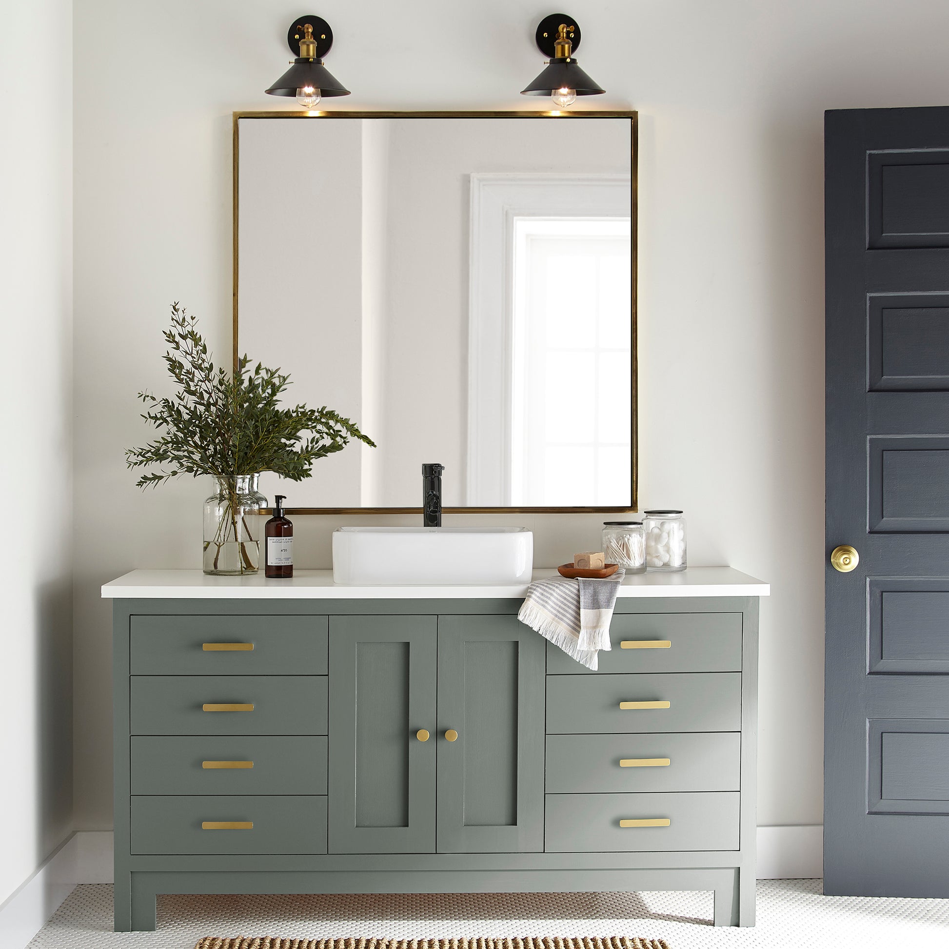 a dark green-grey door and cabinet paint named luxe shown painted on bathroom cabinet 