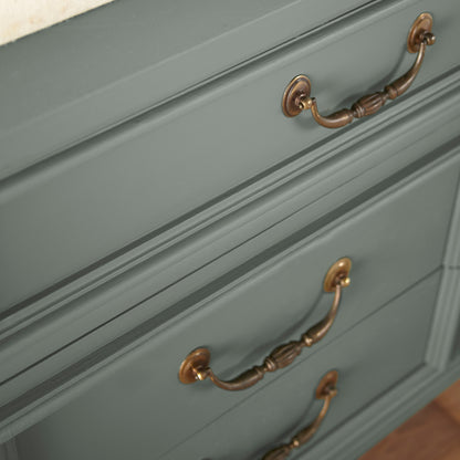 a dark green-grey door and cabinet paint named luxe shown painted on cabinet