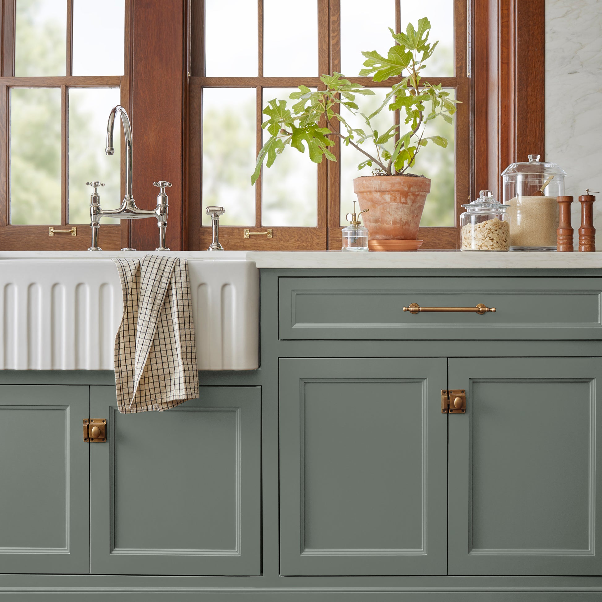 a dark green-grey door and cabinet paint named luxe shown painted on kitchen cabinet