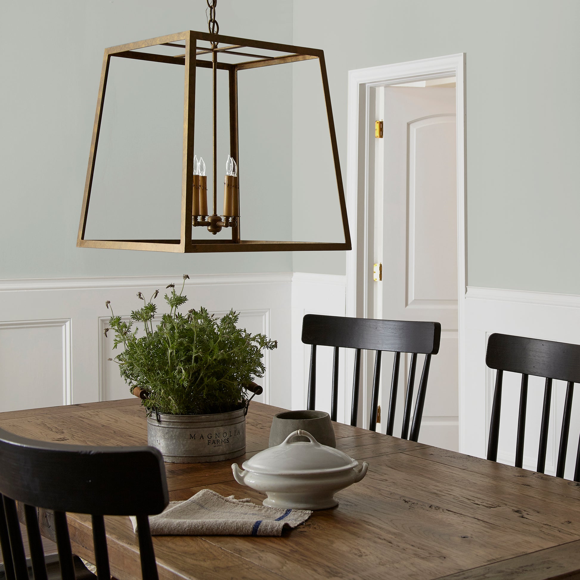 Silver gray tinted with sky blue interior paint named wedding band shown painted on dining room wall