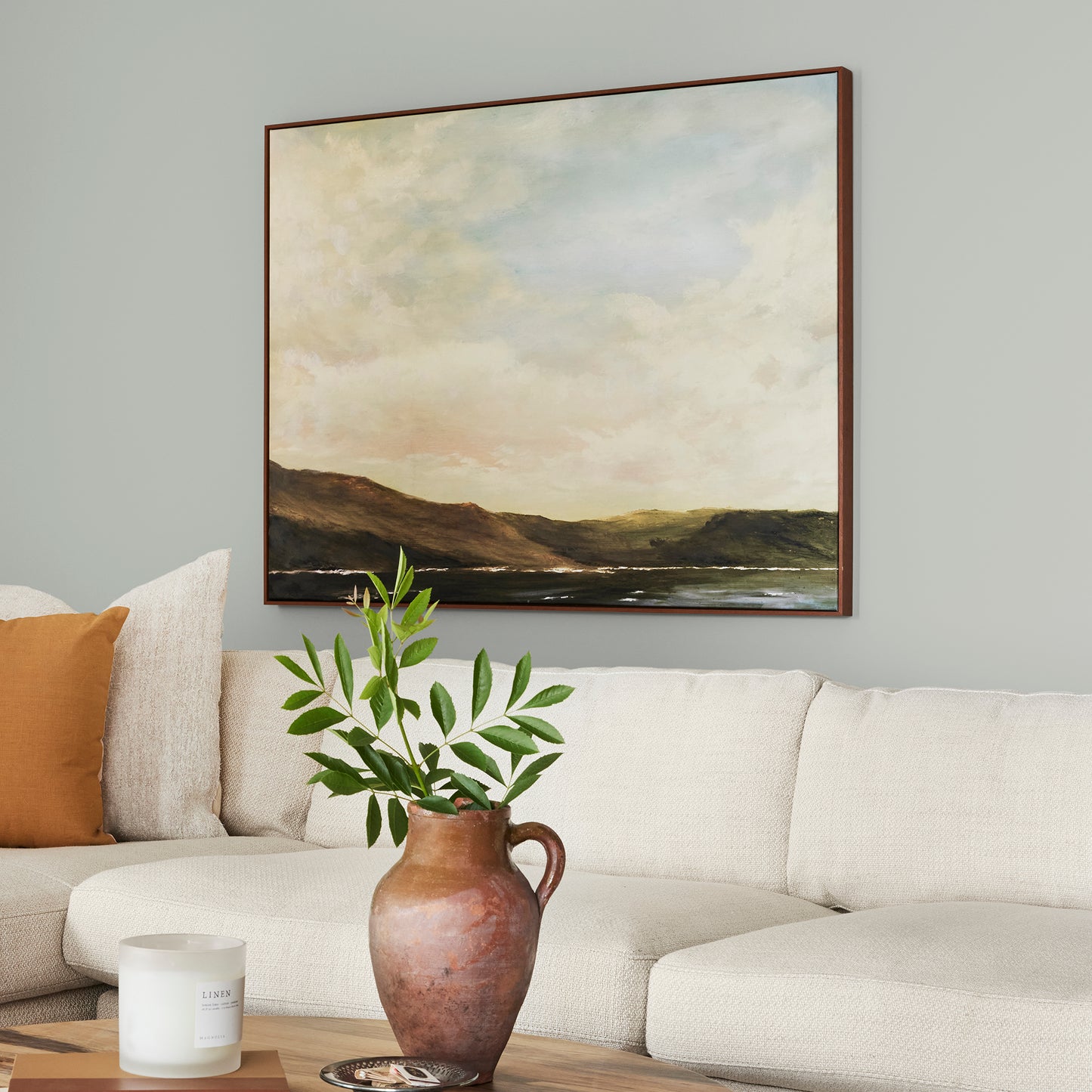 Silver gray tinted with sky blue interior paint named wedding band shown painted on living room wall
