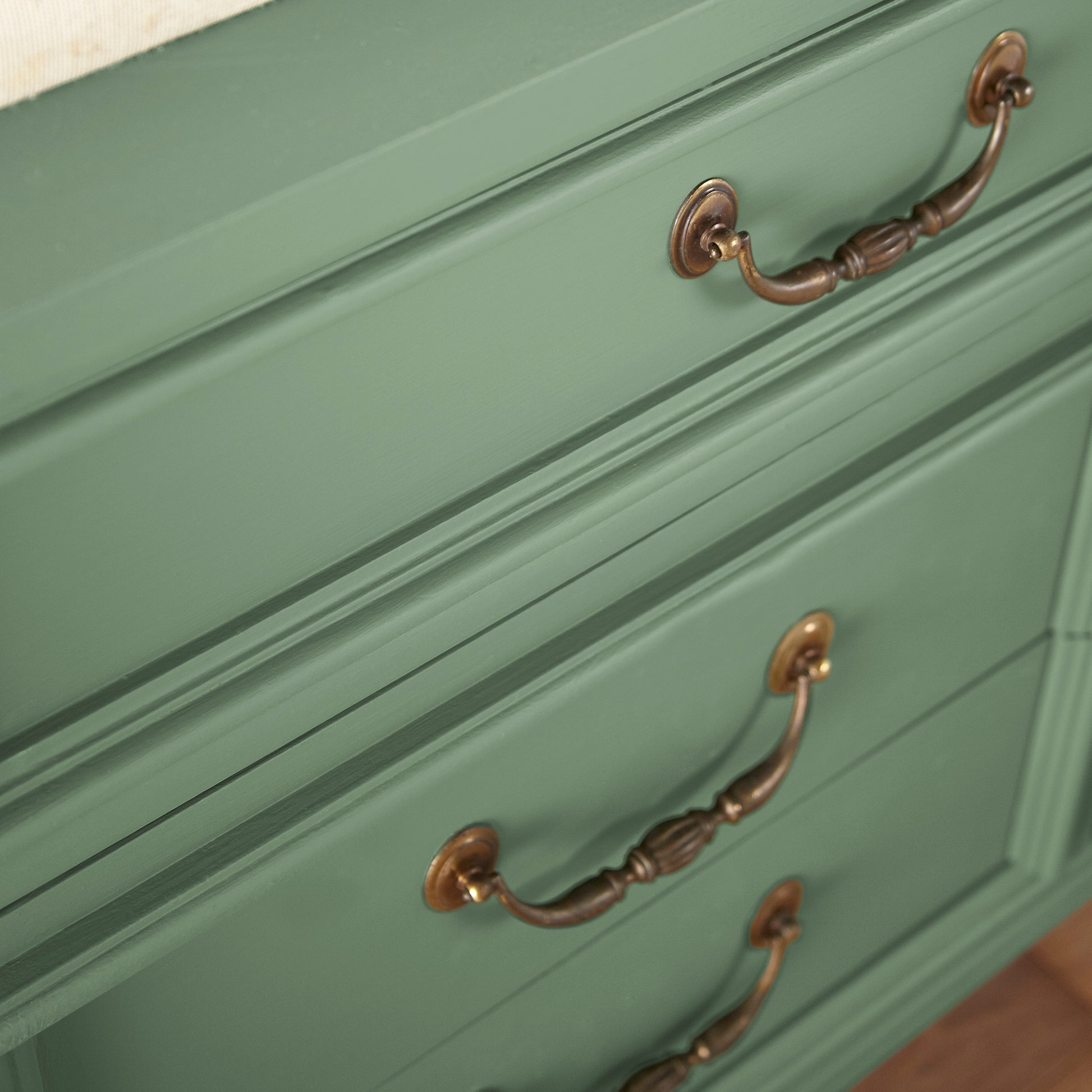 Bold and crisp green trim, door and cabinetry paint named Magnolia Green shown painted on cabinet