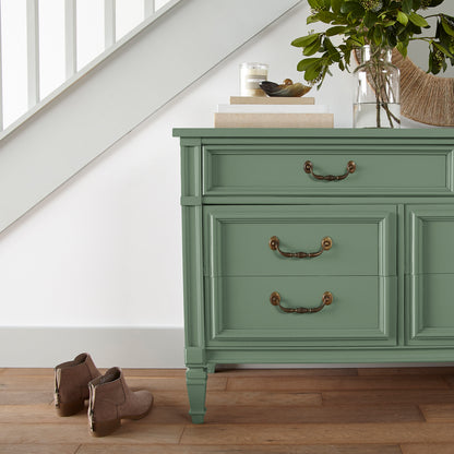 Bold and crisp green trim, door and cabinetry paint named Magnolia Green shown painted on entryway cabinet