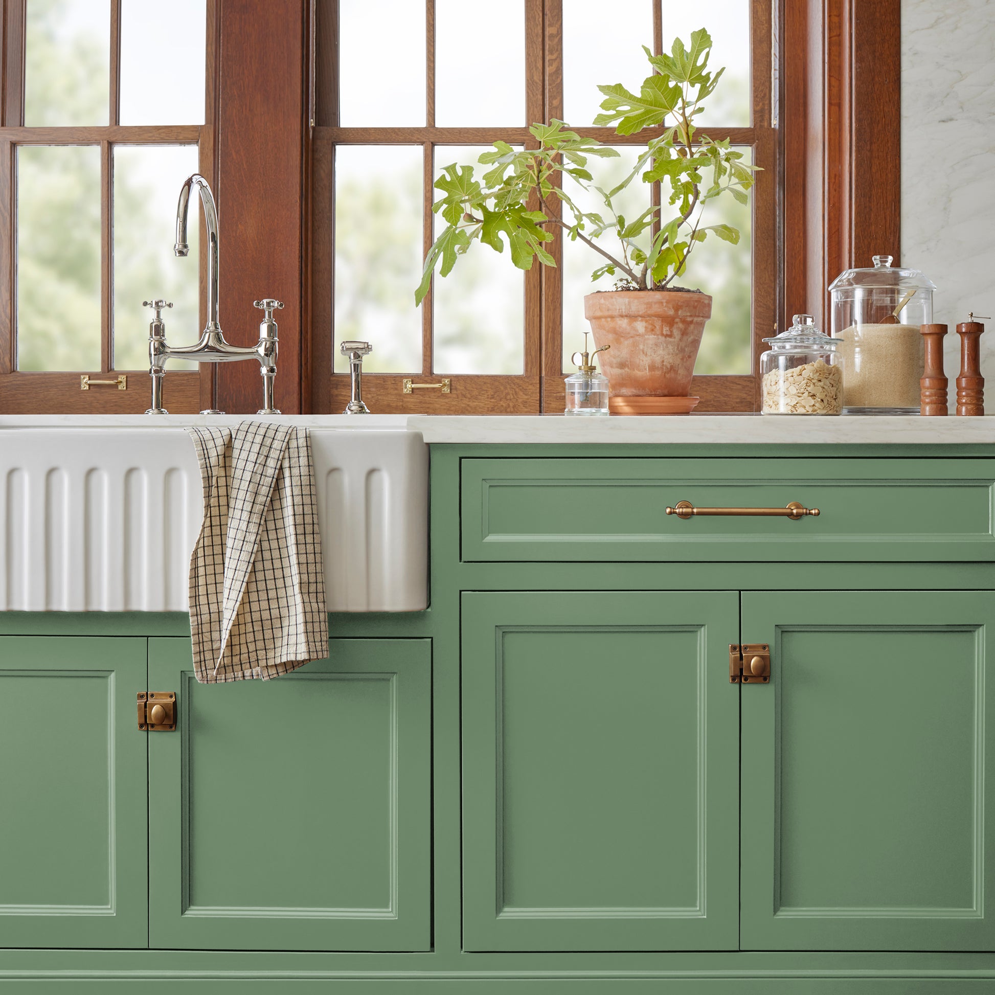 Bold and crisp green trim, door and cabinetry paint named Magnolia Green shown painted on kitchen cabinet