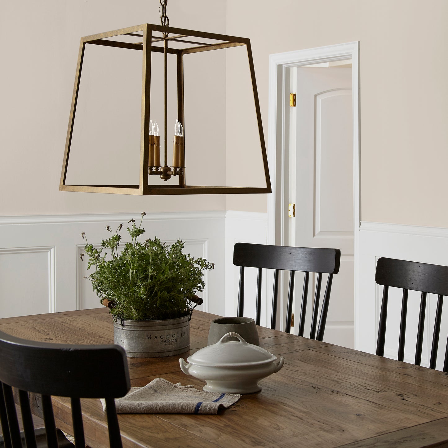 Oatmeal white with peach undertones interior paint named soft linen shown painted on dining room wall