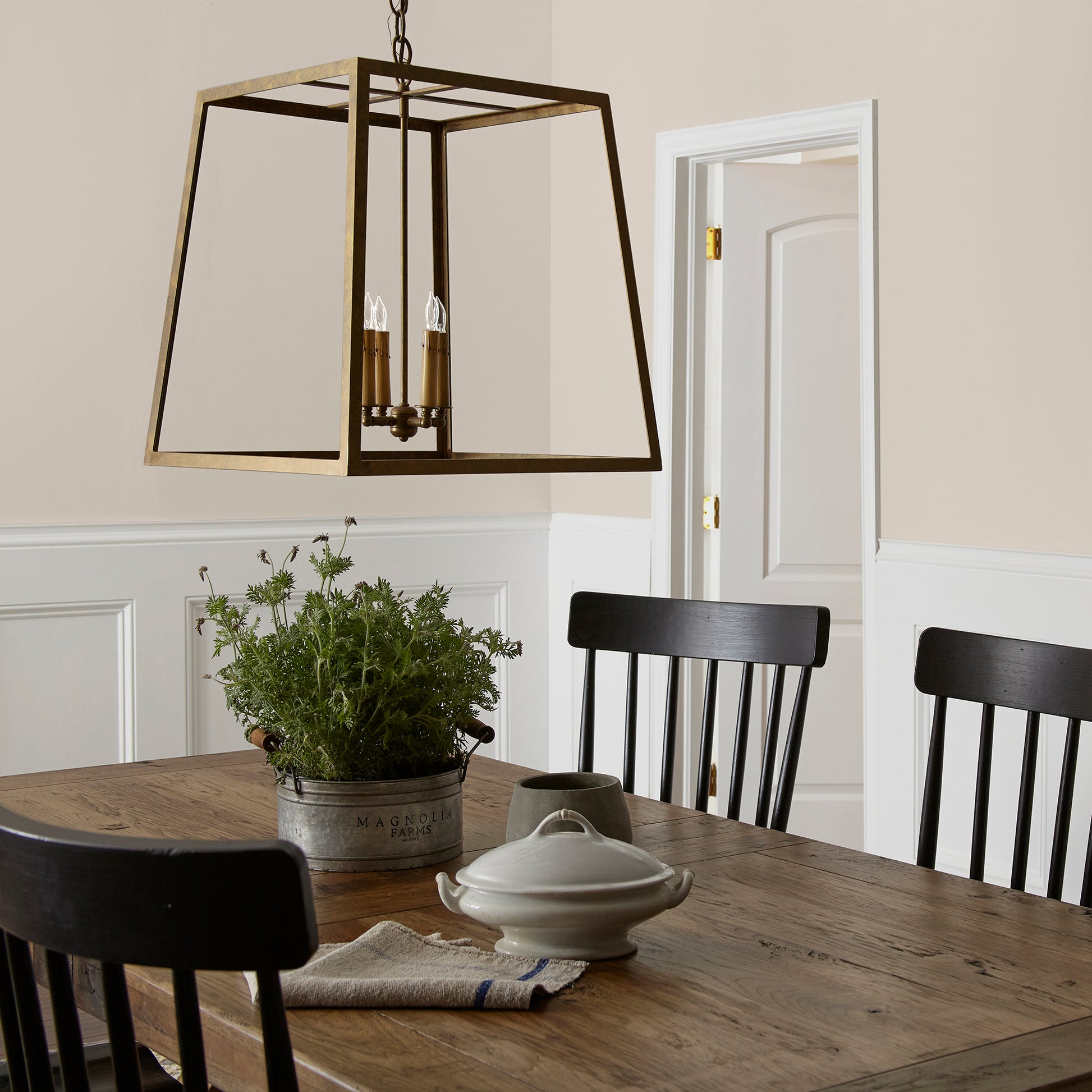 Oatmeal white with peach undertones interior paint named soft linen shown painted on dining room wall