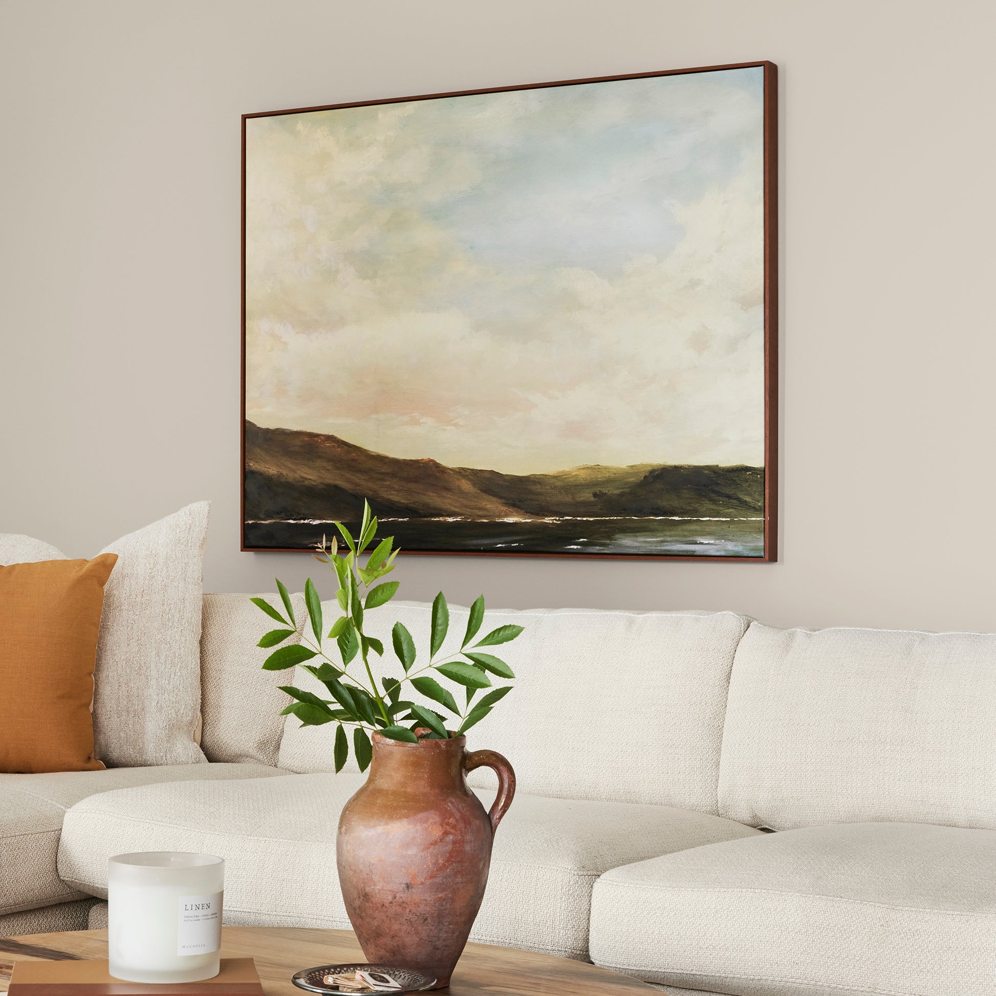 Oatmeal white with peach undertones interior paint named soft linen shown painted on living room wall