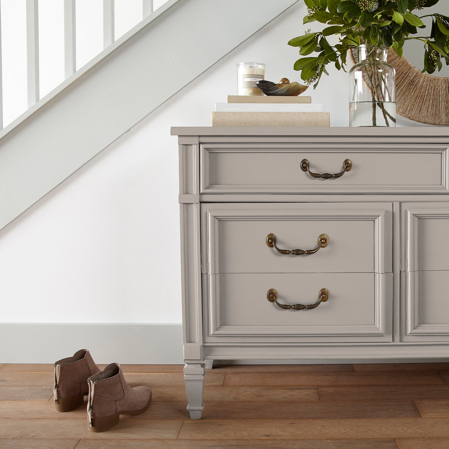 Sandy tan with pink door and cabinet paint named cinnamon sugar shown painted on entryway cabinet