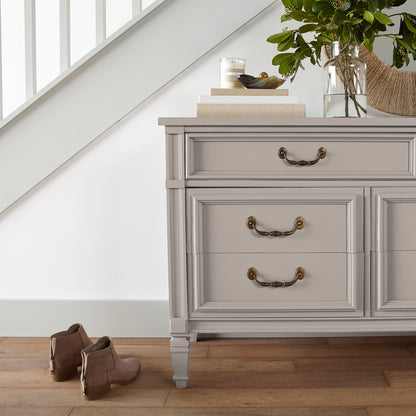 Sandy tan with pink door and cabinet paint named cinnamon sugar shown painted on entryway cabinet
