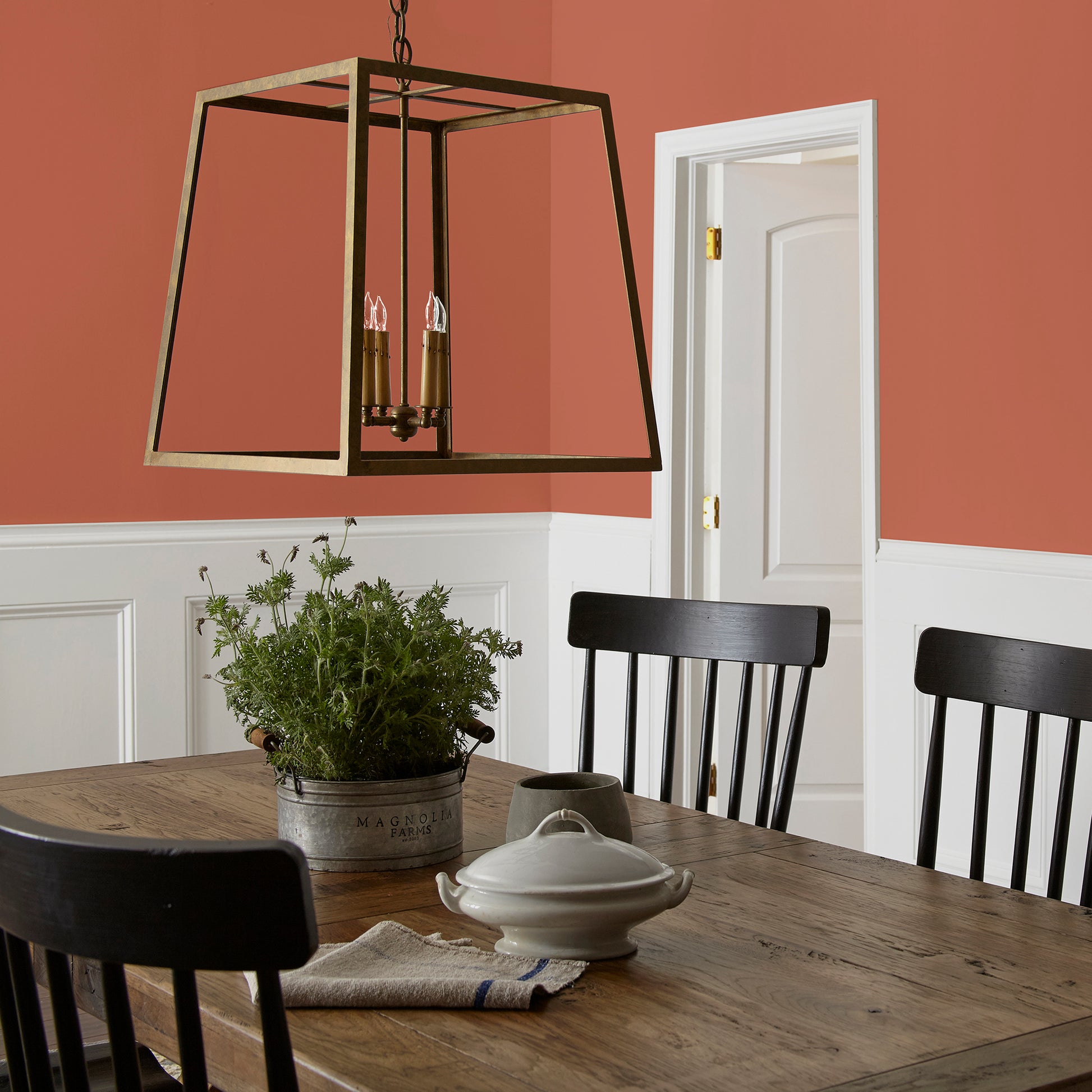 Deep Terra Cotta interior paint named on bosque shown painted on dining room wall