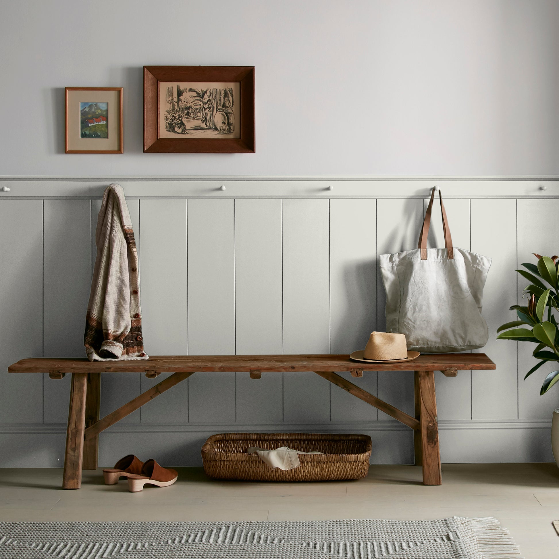 Light gray with green undertone paint named piece of cake shown painted on entryway wall