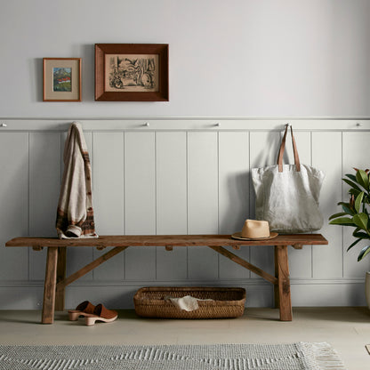 Light gray with green undertone paint named piece of cake shown painted on entryway wall