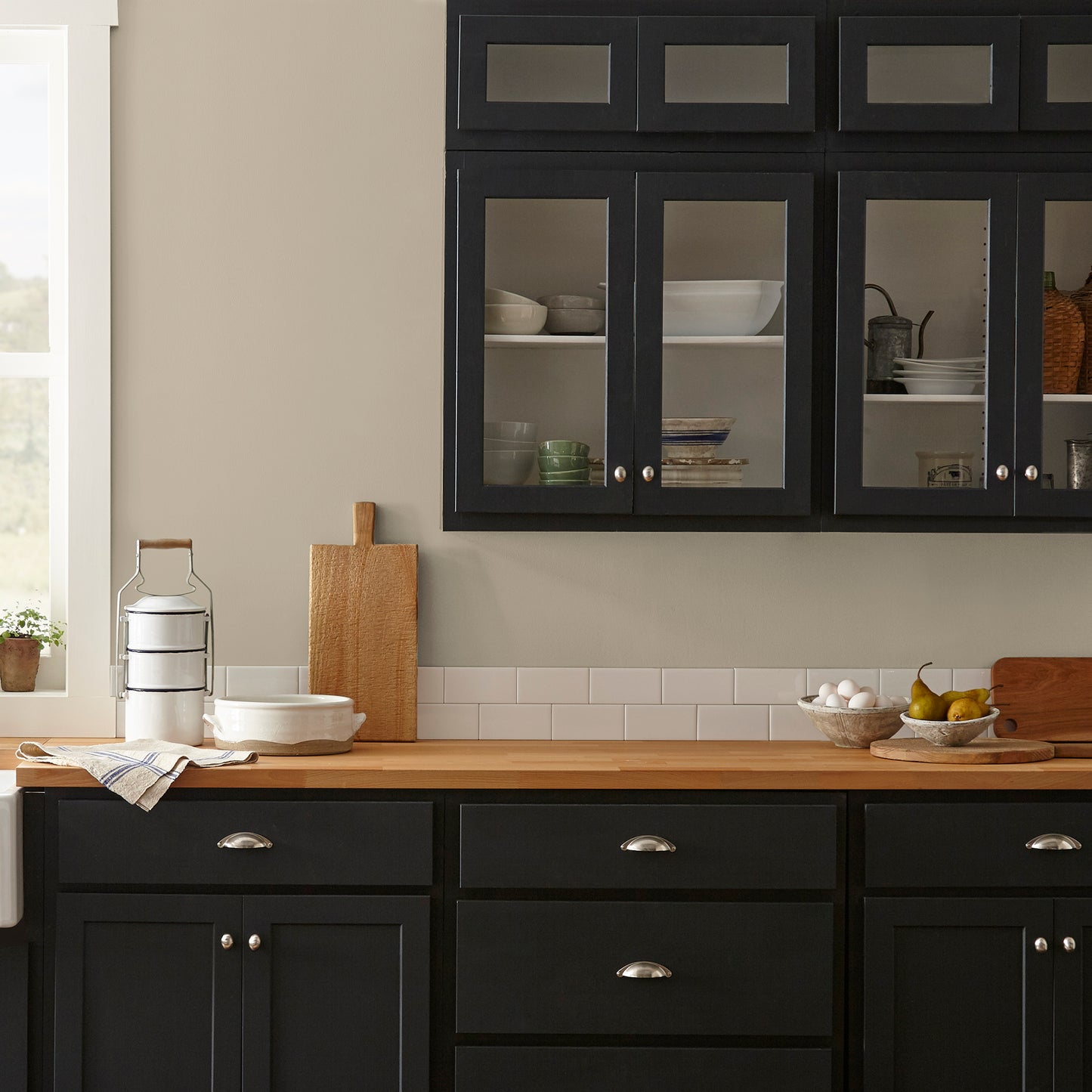 A khaki green interior paint named gold moss shown painted on kitchen wall