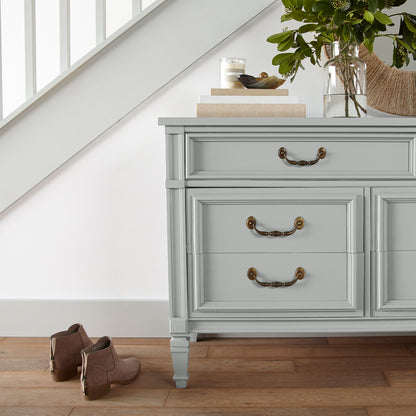 Soft light gray with blue undertone door and cabinet paint named dark moon shown painted on entryway cabinet