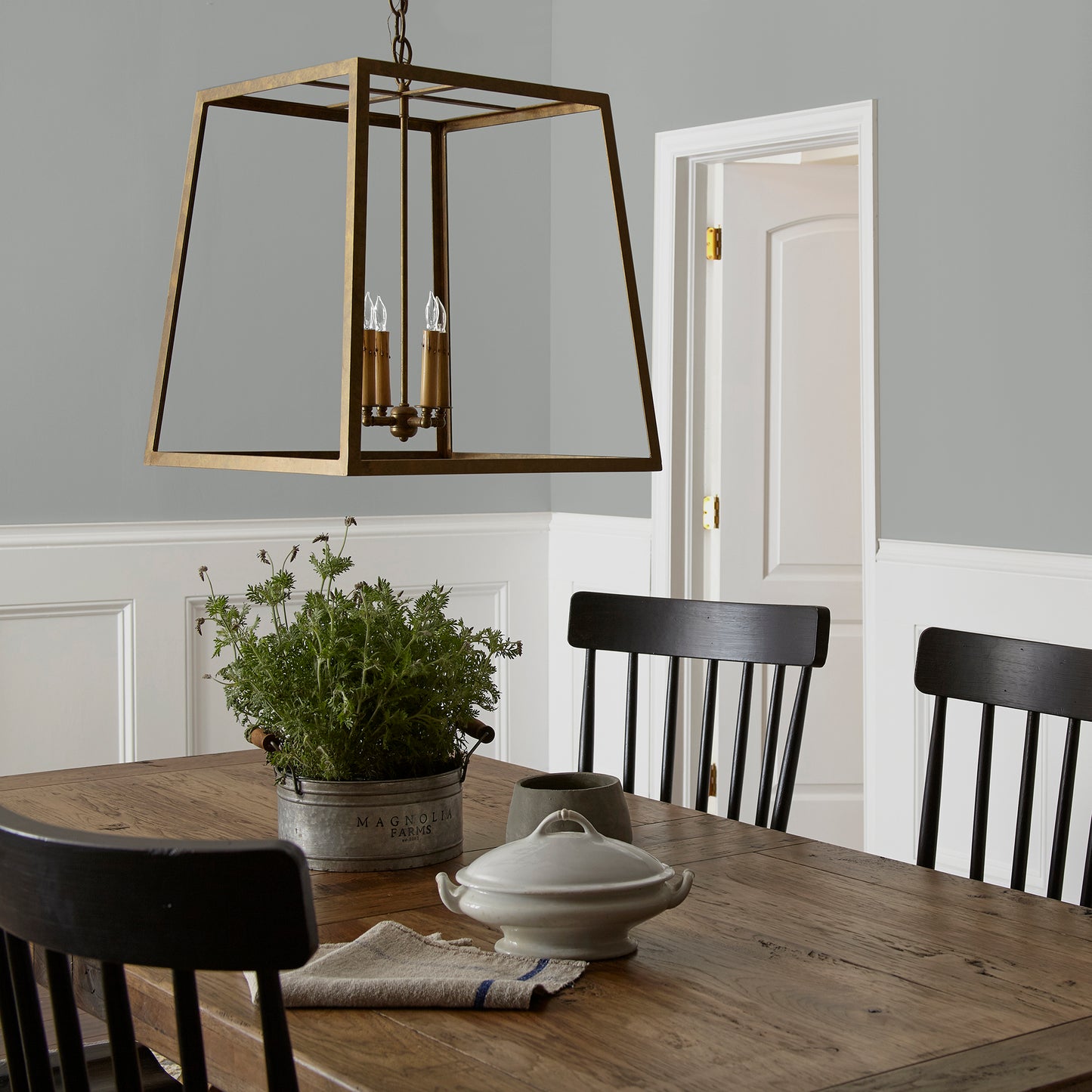 warm charcoal grey interior paint named vintage weathervane shown painted on dining room wall