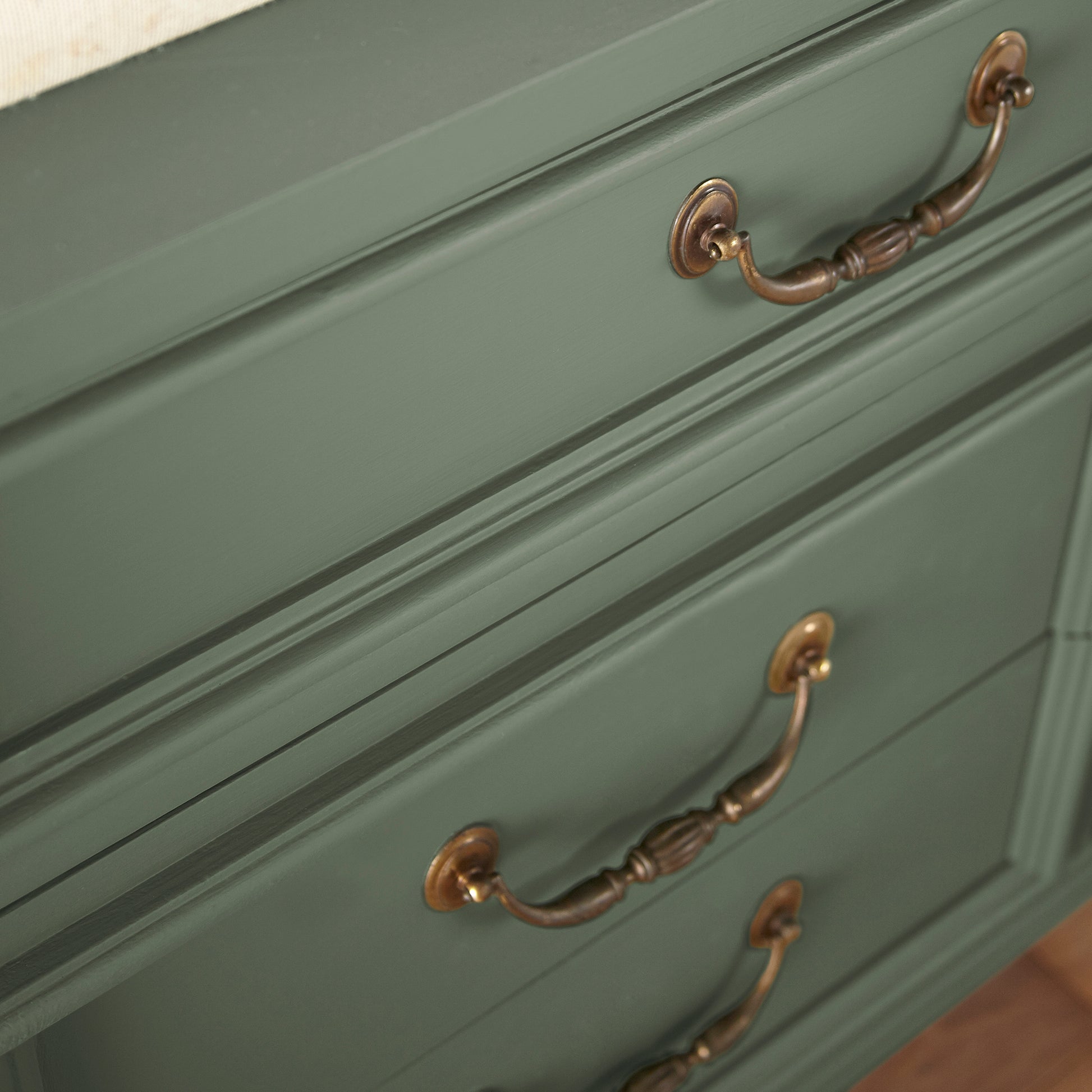 Soft light gray with blue undertone door and cabinet paint named lemon leaves shown painted on cabinet