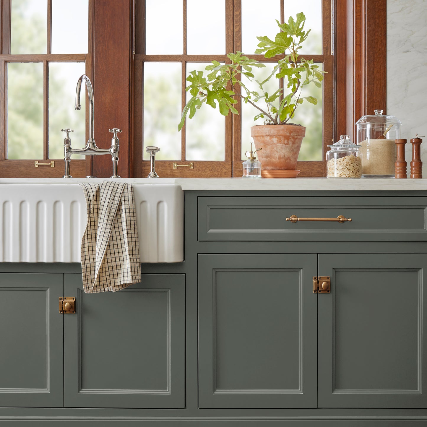 Dark hunter green dusted with olive tones door and cabinet paint named locally grown shown painted on kitchen cabinet 