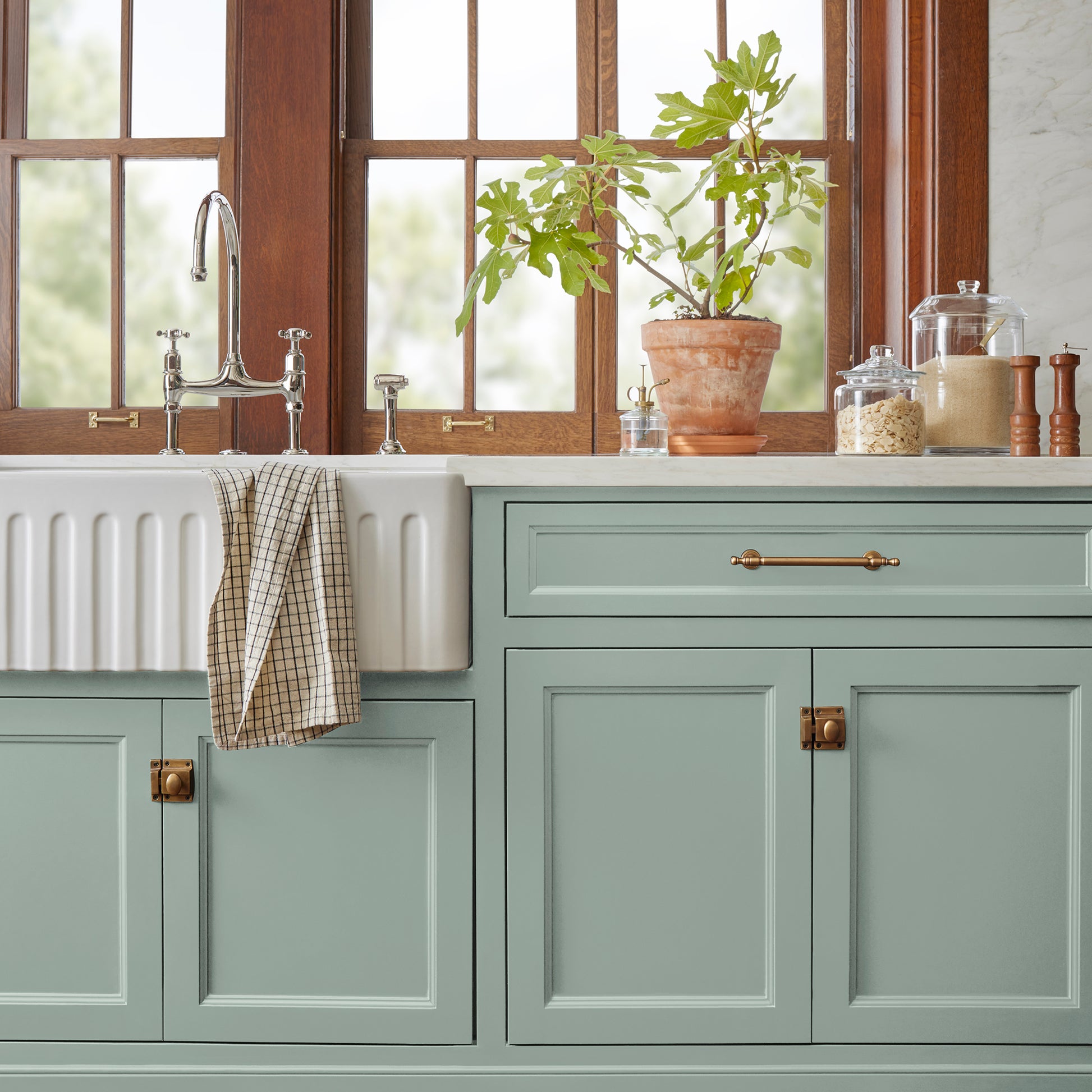 Washed mint green door and cabinet paint named local greenhouse shown painted on kitchen cabinet  