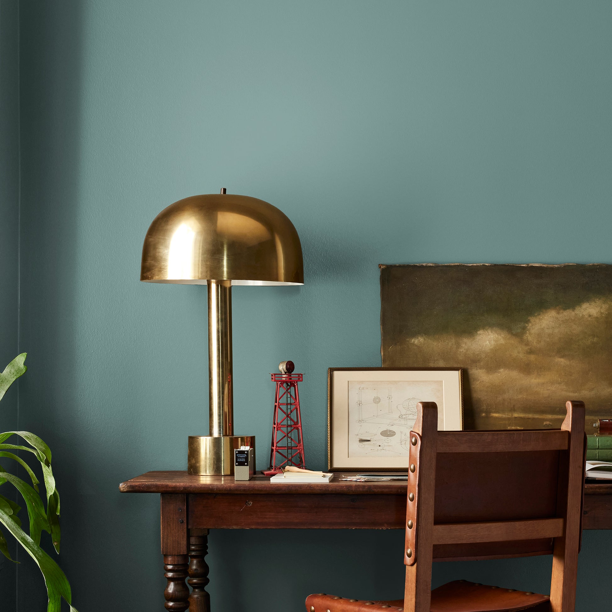 A dark, dusty aqua interior paint named tranquility shown painted on bedroom wall