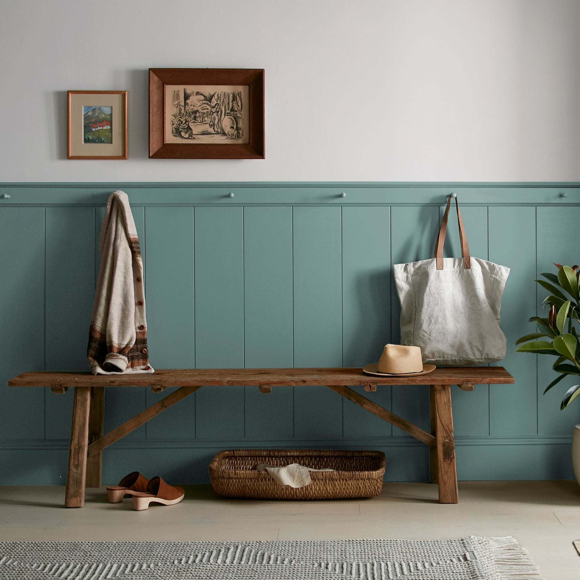 A dark, dusty aqua interior paint named tranquility shown painted on entryway wall