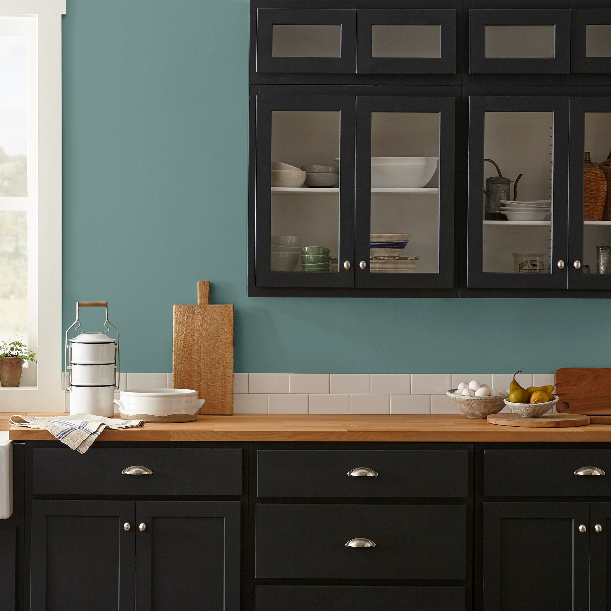 A dark, dusty aqua interior paint named tranquility shown painted on kitchen wall