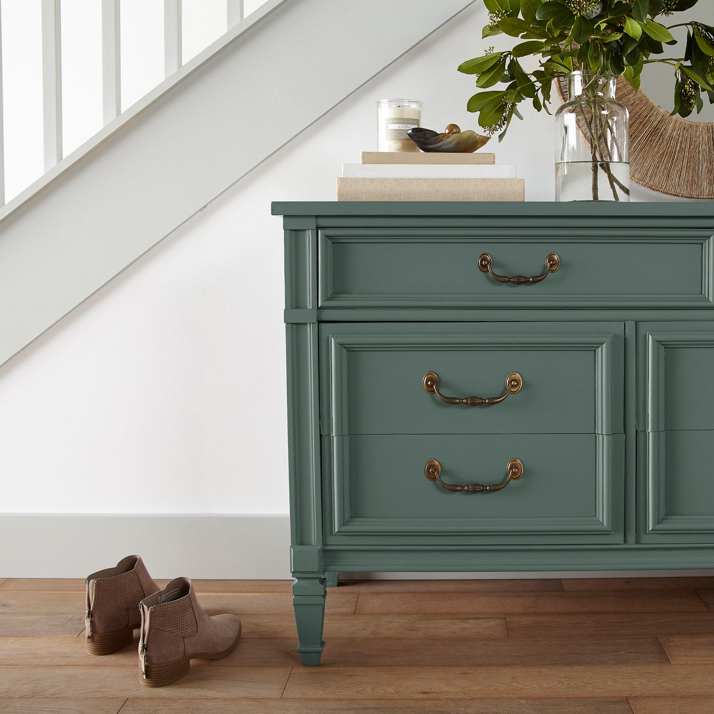 Deep hunter green comparable to pine tree leaves door and cabinet paint named regal leaf shown painted on entryway cabinet