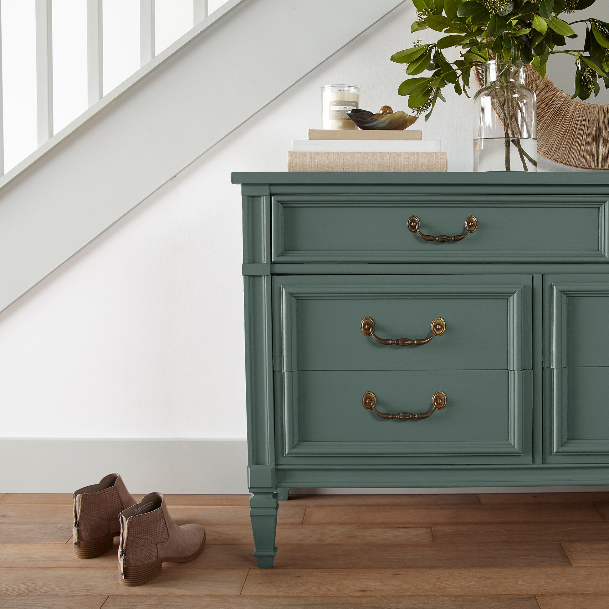 Deep hunter green comparable to pine tree leaves door and cabinet paint named regal leaf shown painted on entryway cabinet