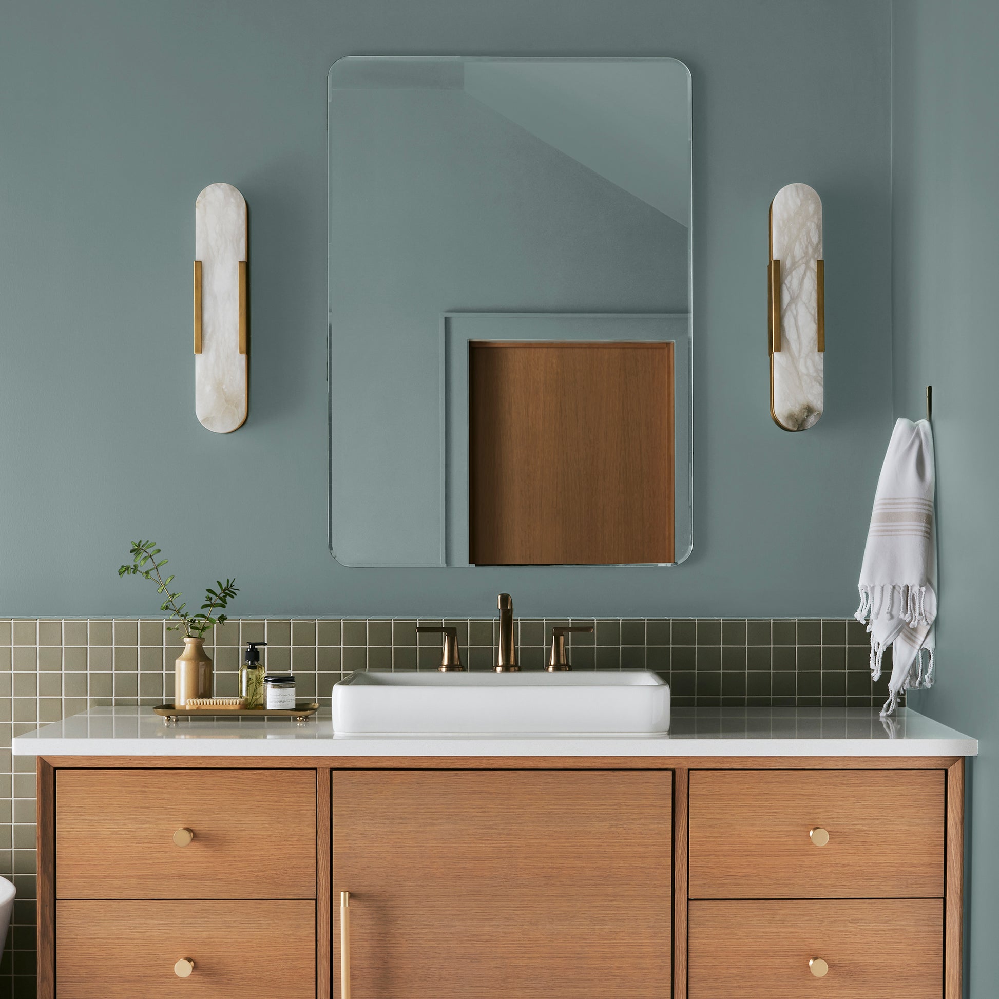 Ashy green with aqua undertone interior paint named well watered shown painted on bathroom wall