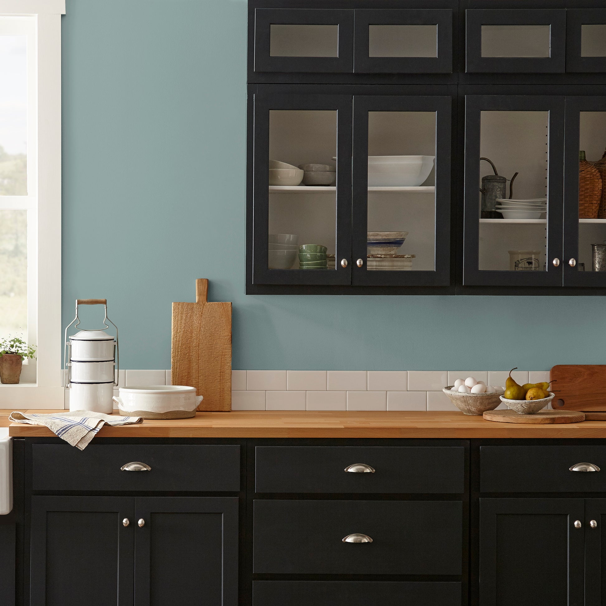 Ashy green with aqua undertone interior paint named well watered shown painted on kitchen wall