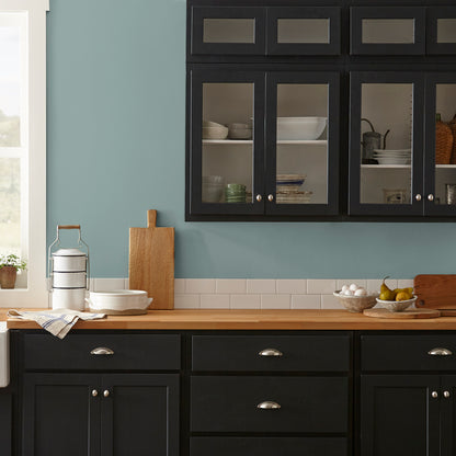 Ashy green with aqua undertone interior paint named well watered shown painted on kitchen wall