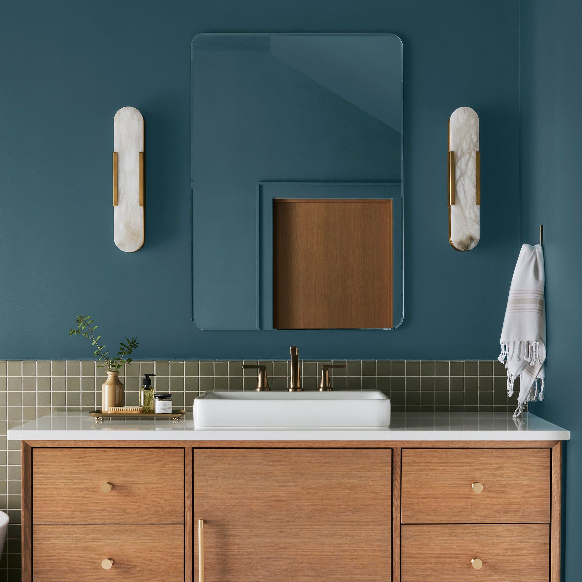 Deep denim blue interior paint named signature shown painted on bathroom wall