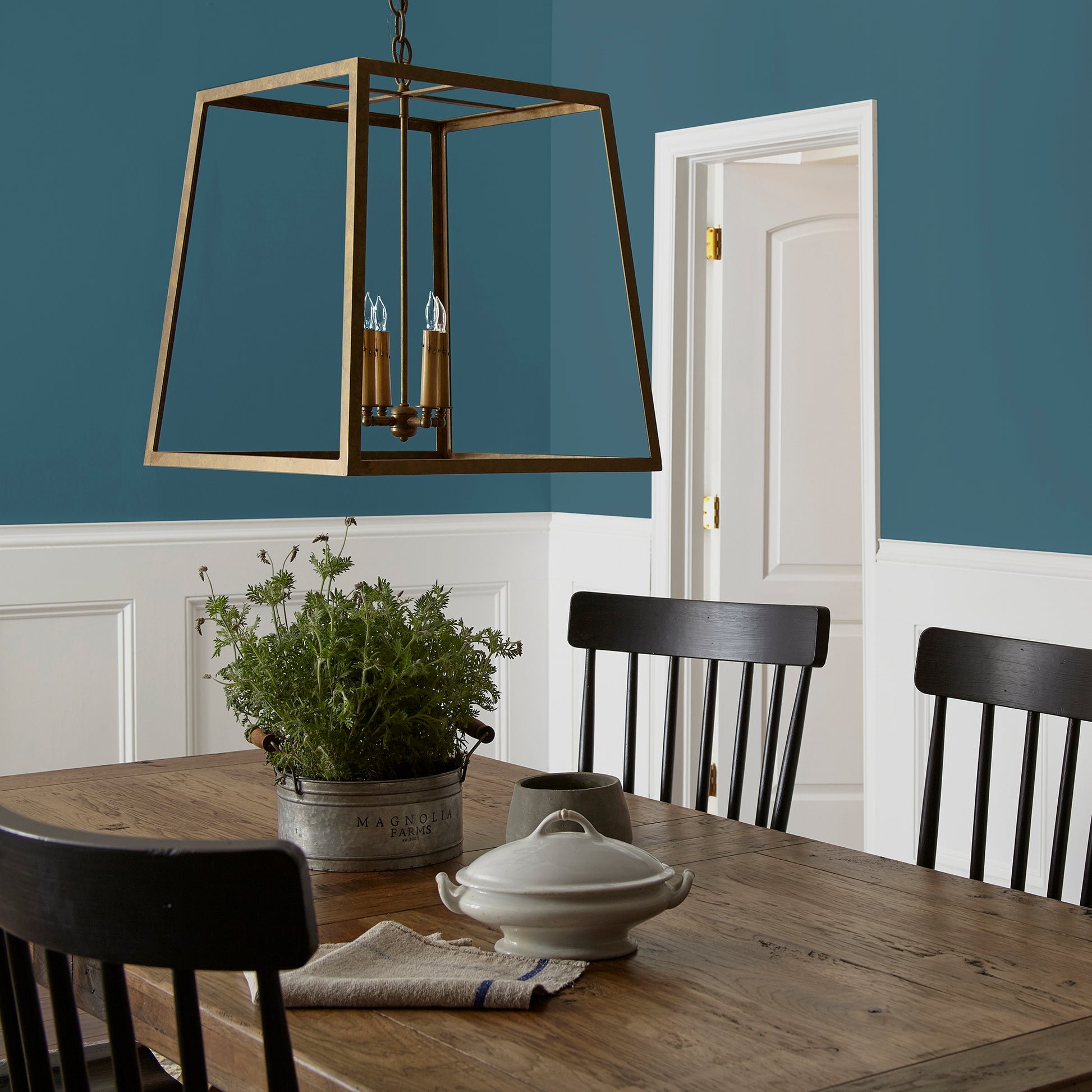 Deep denim blue interior paint named signature shown painted on dining room wall