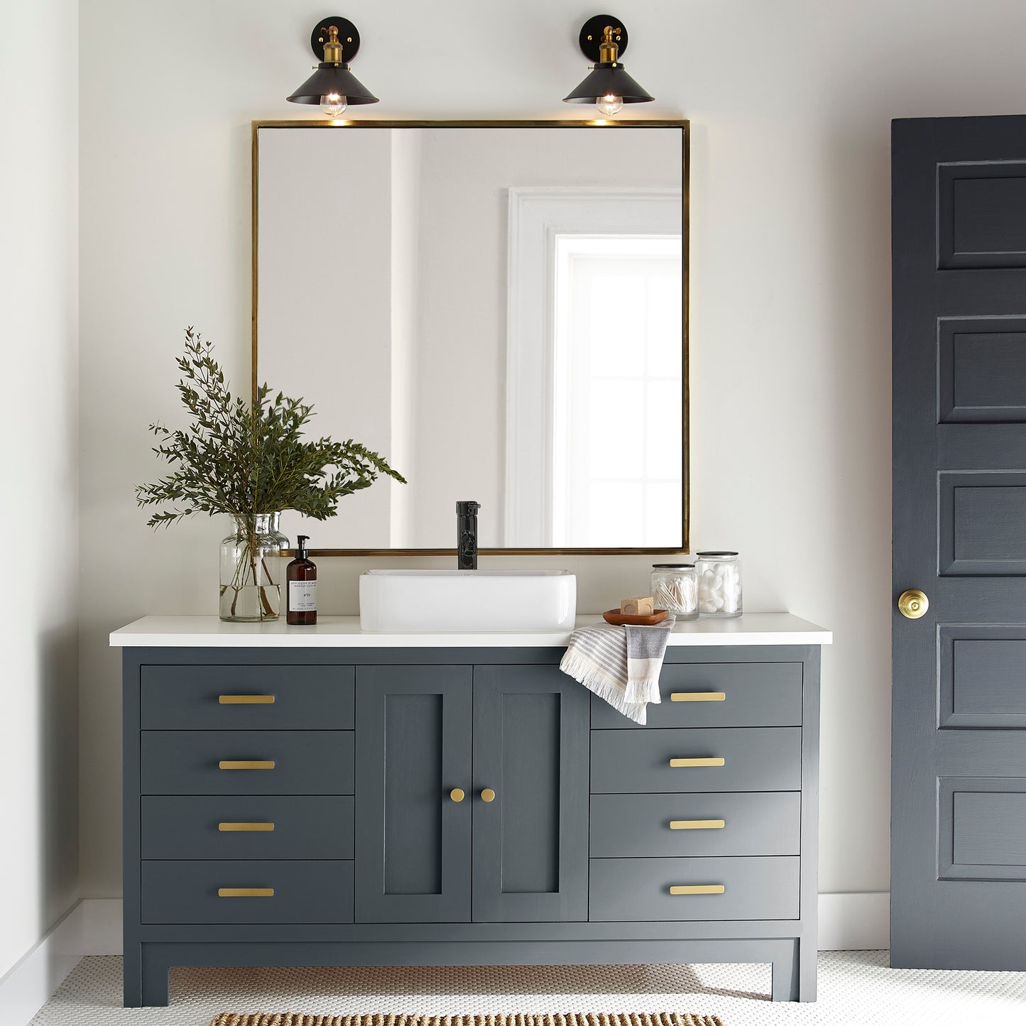 Almost black with dark blue undertones door and cabinet paint named arches shown painted on bathroom cabinet