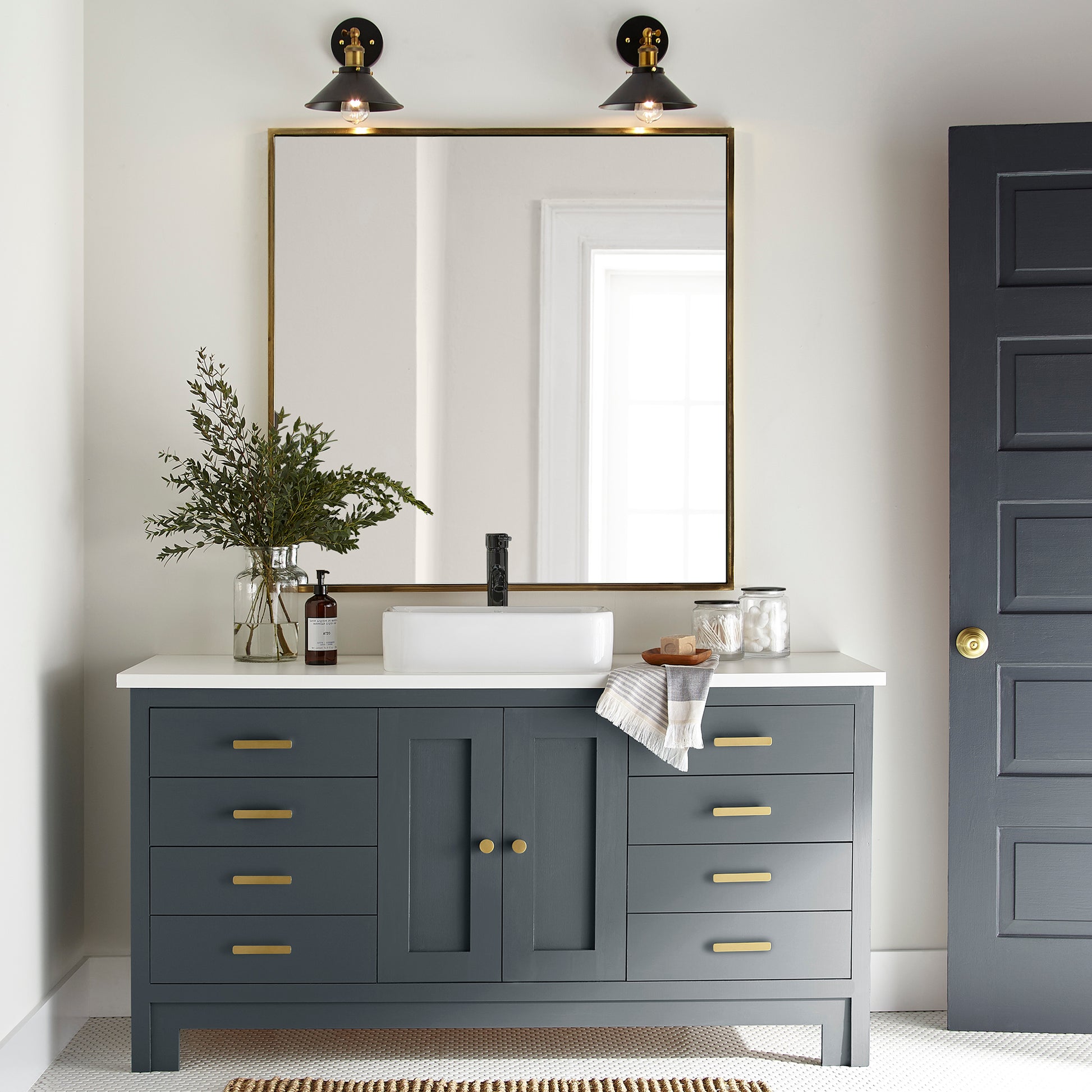 Almost black with dark blue undertones door and cabinet paint named arches shown painted on bathroom cabinet
