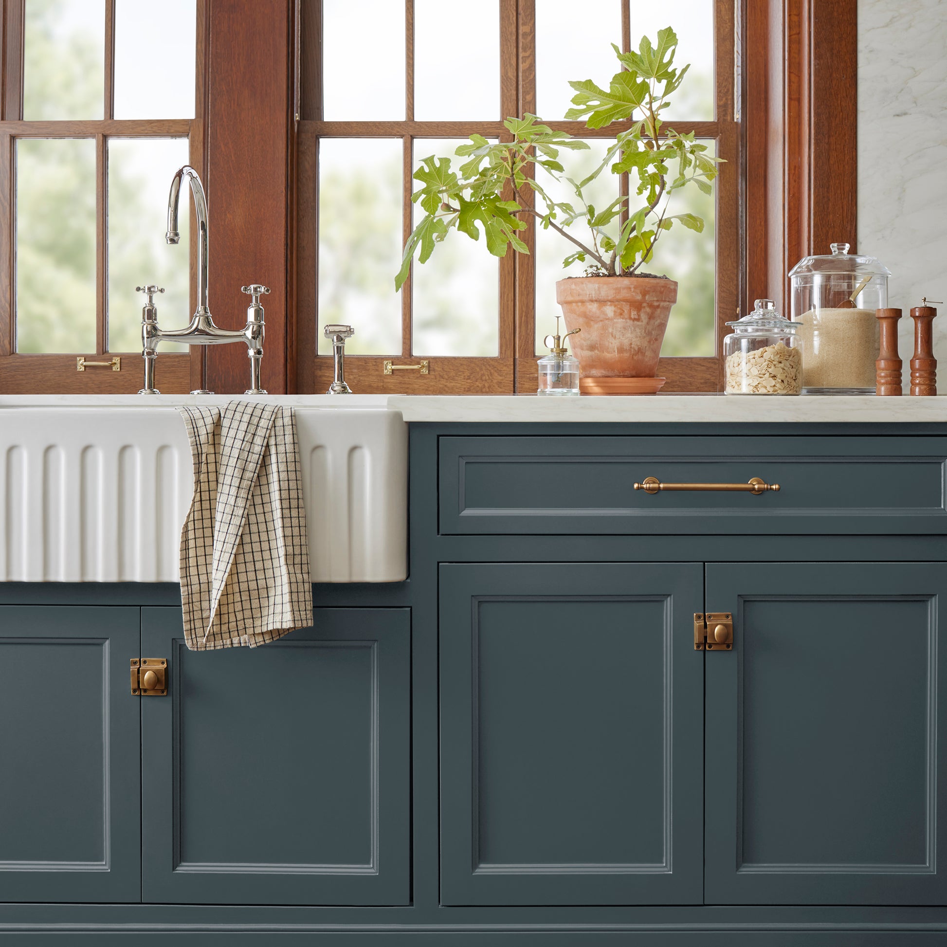 Almost black with dark blue undertones door and cabinet paint named arches shown painted on kitchen cabinet  