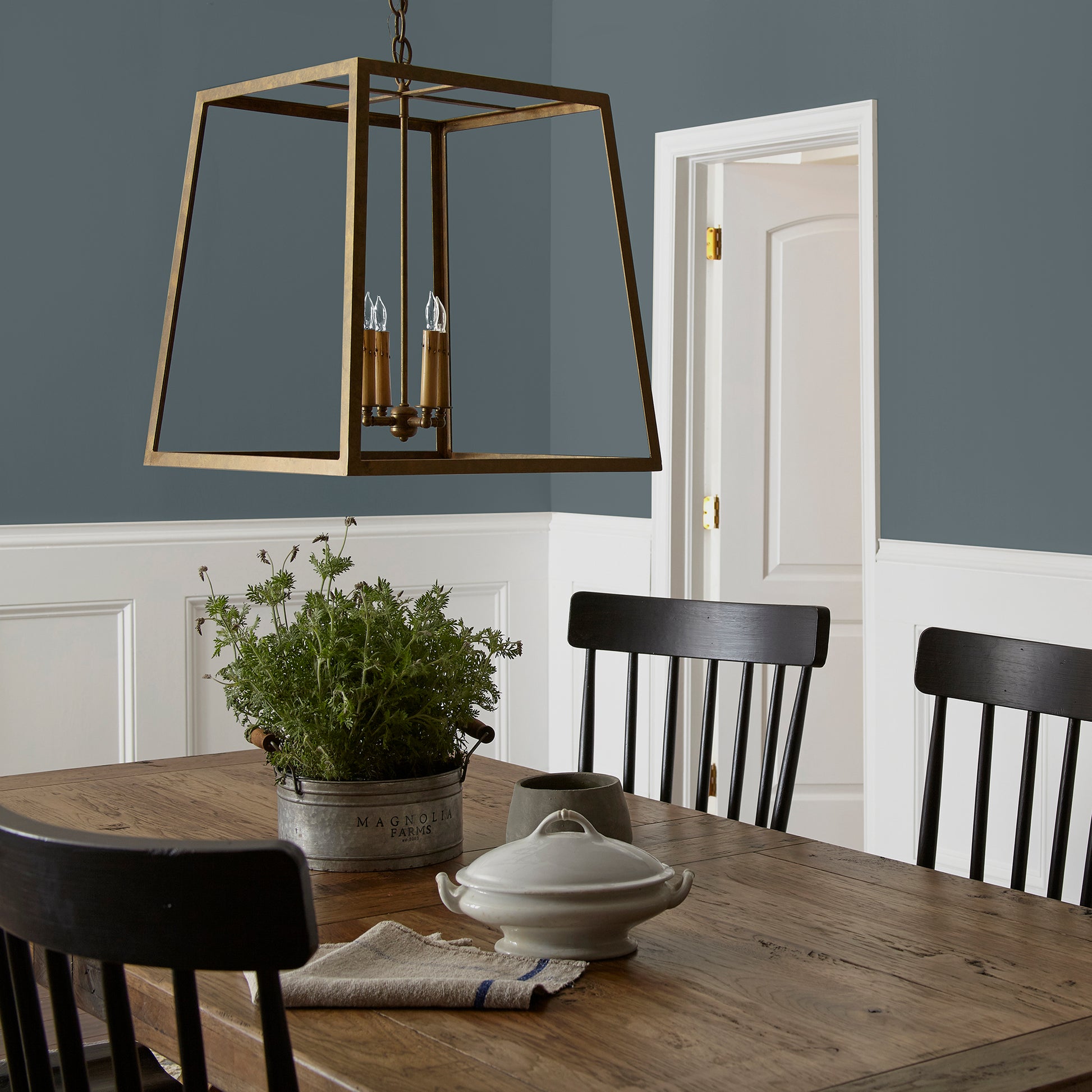 smoky grey paint with blue undertones named coffee nook shown painted on dining room wall