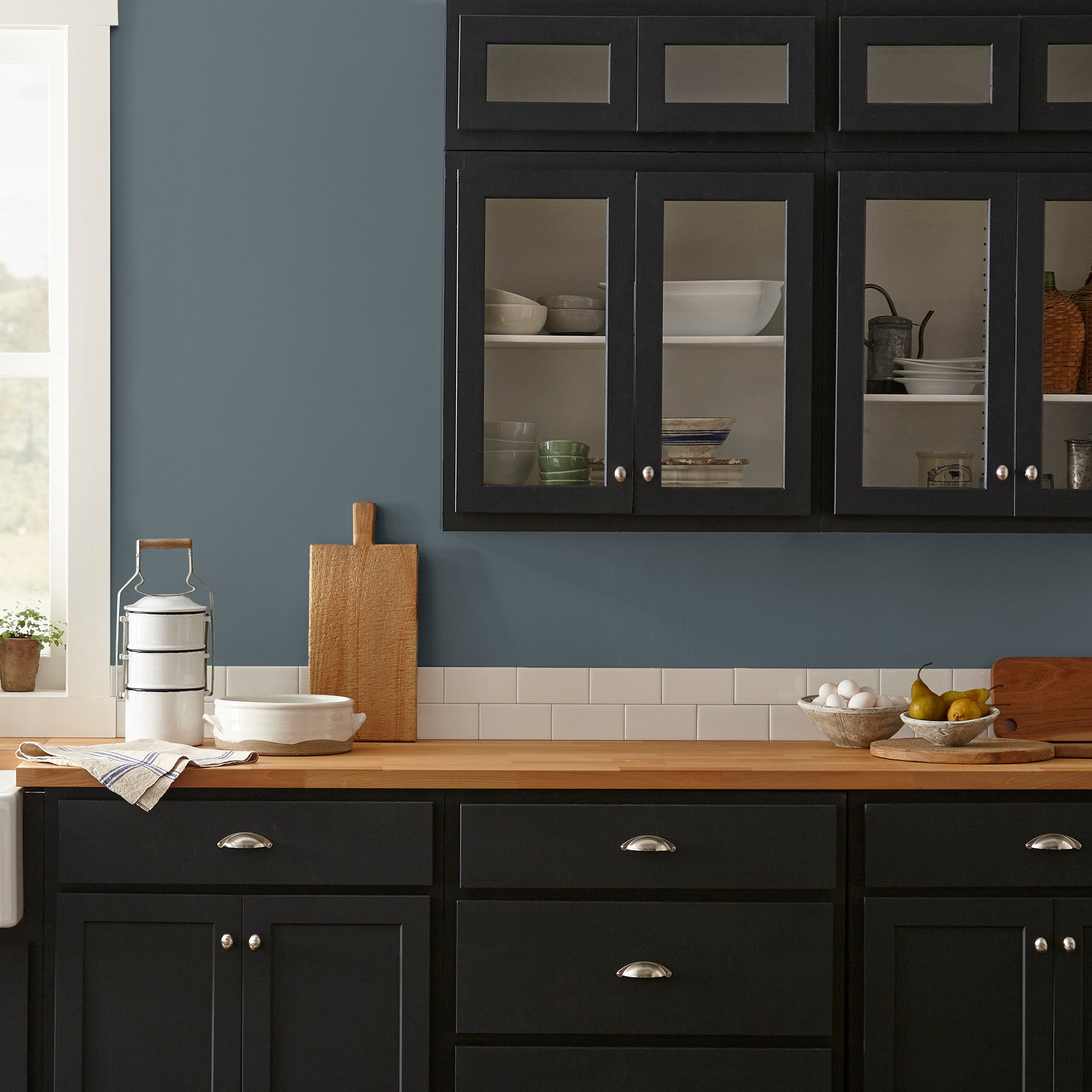 smoky grey paint with blue undertones named coffee nook shown painted on kitchen wall