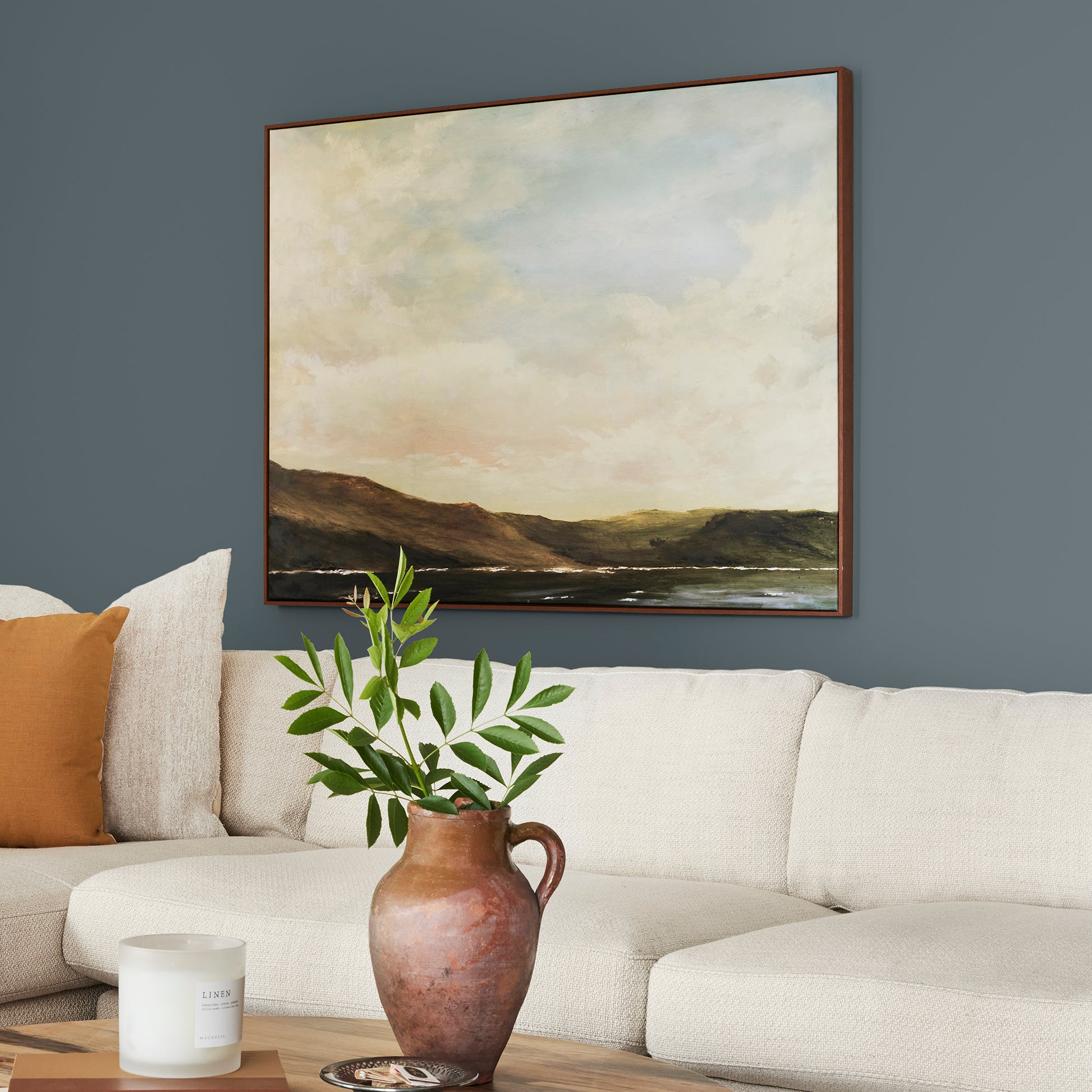 smoky grey paint with blue undertones named coffee nook shown painted on living room wall