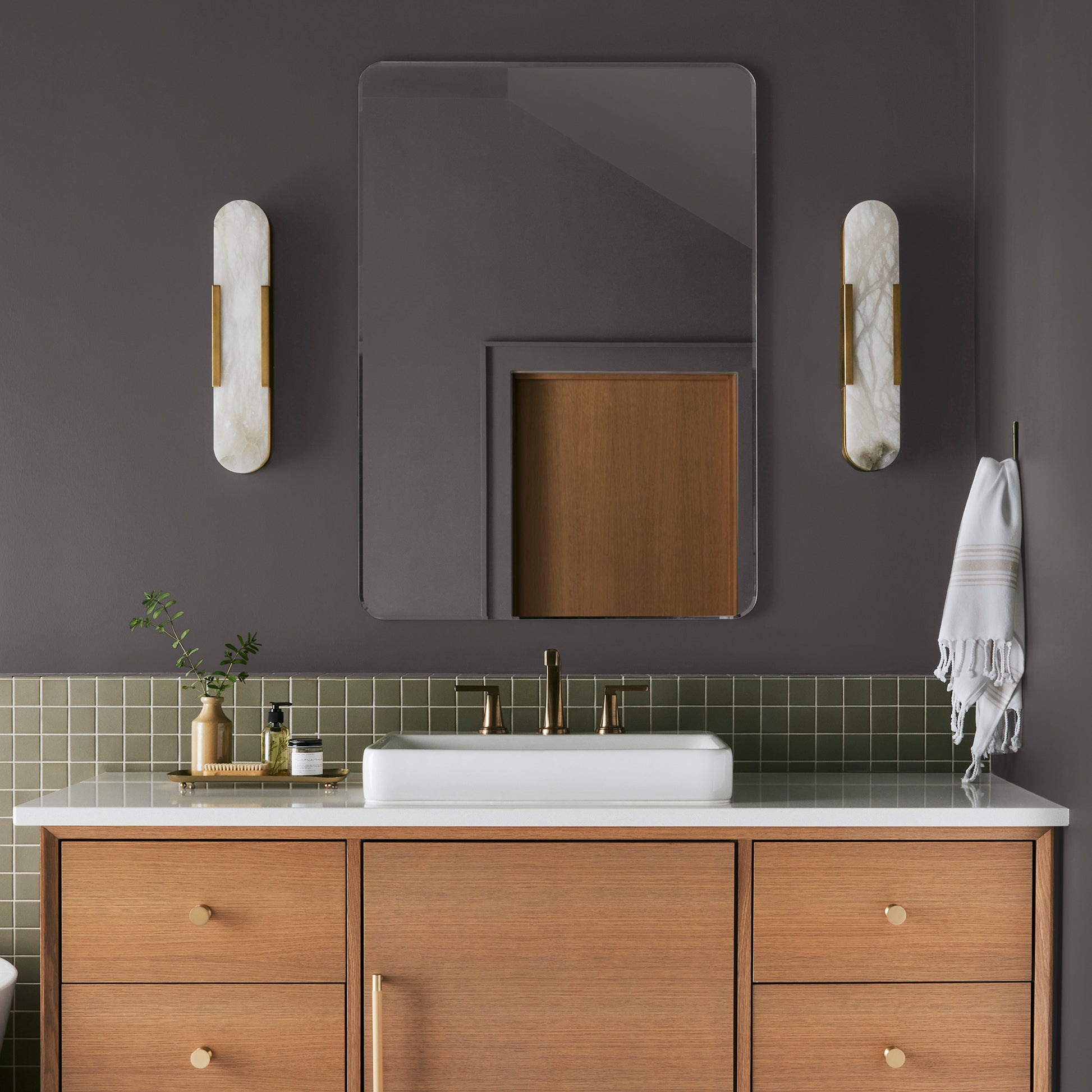 Deep brown with wine and beet red hues interior paint named pecan grove shown painted on bathroom wall
